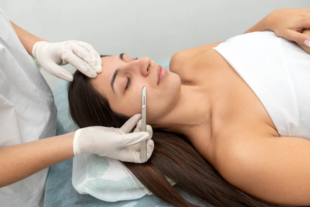 A dermaplaning facial procedure being performed to exfoliate and rejuvenate the skin.