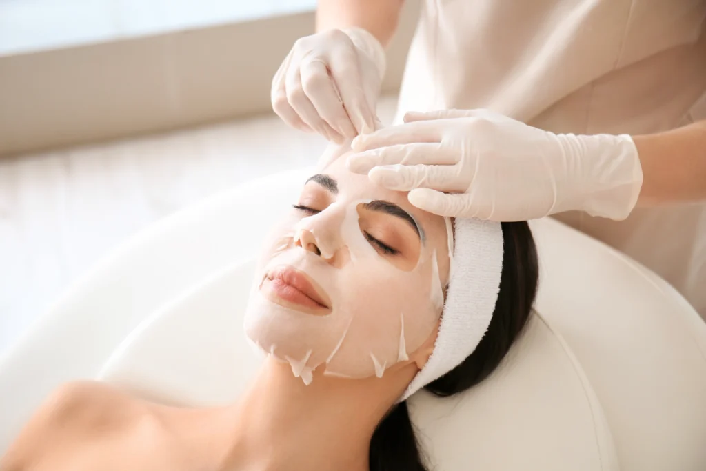 A relaxing facial mask treatment is applied to enhance skin rejuvenation and hydration during a professional facials session.