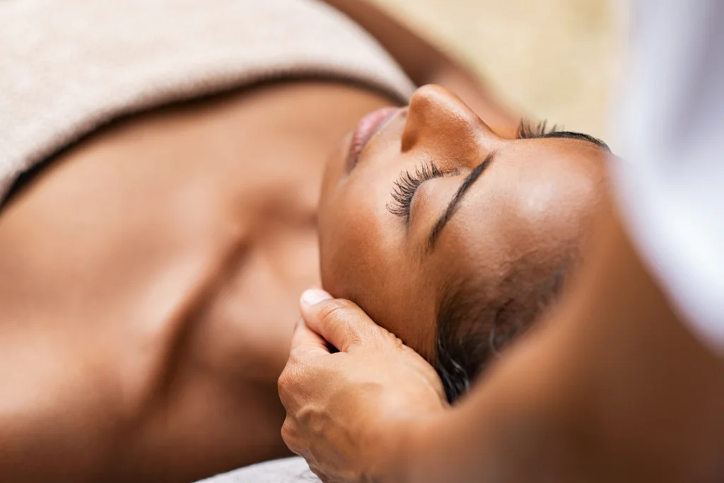 A client experiences a calming facials session focused on skin care and relaxation for improved complexion and texture.