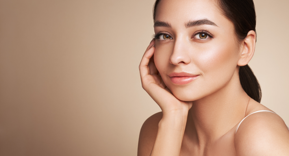 Woman with glowing skin after PRP Microneedling.