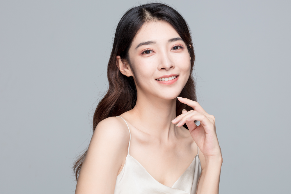 Woman with glowing skin after facials.